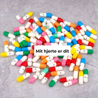 Kapsler med besked i gaveflaske